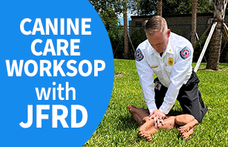 Canine Care Workshop image of firefighter giving CPR to dog